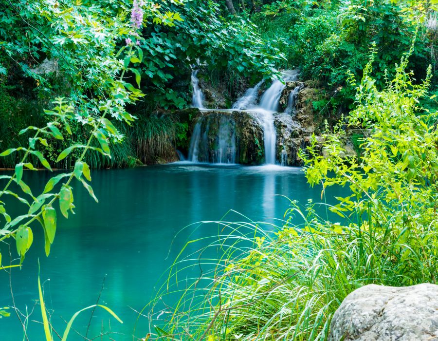 Waterfall Polylimnio with a lot of green in Gialova. 