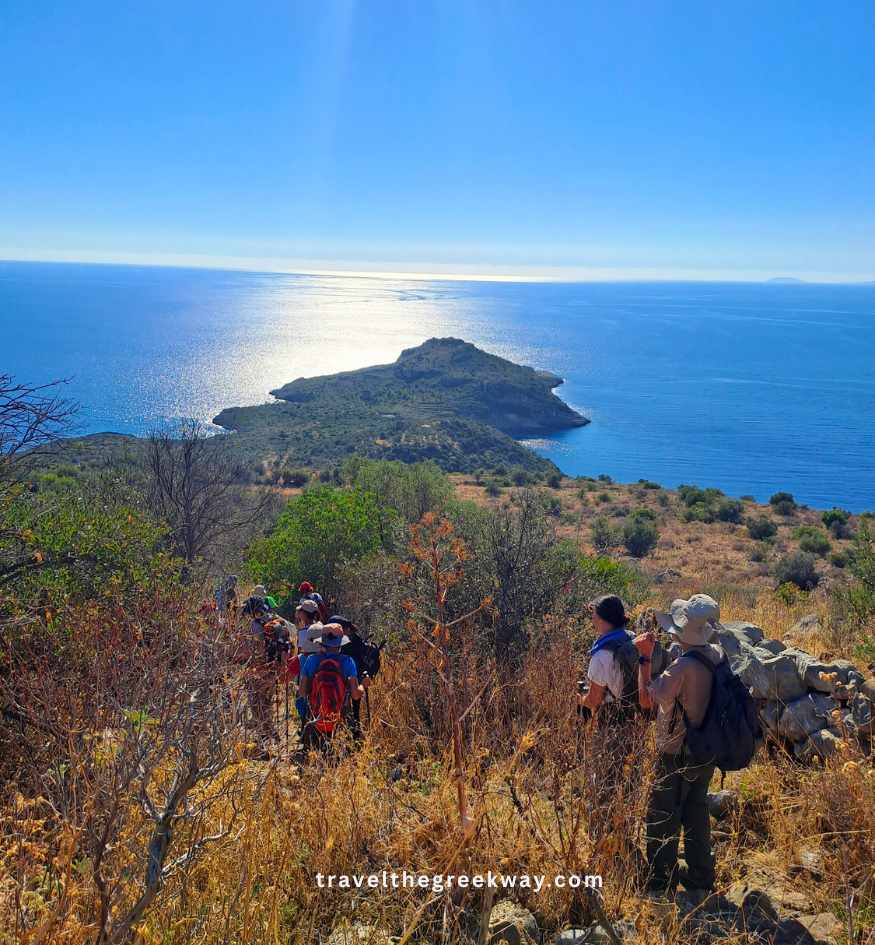A group of hikers overlooking the scenic coastline in Mani Greece.