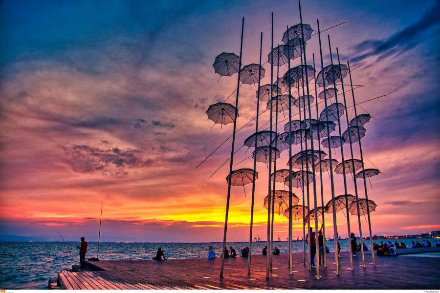 The Best Hotels in Thessaloniki -  Sunset in the promenade infront of the umbrella site with people admiring the sunset