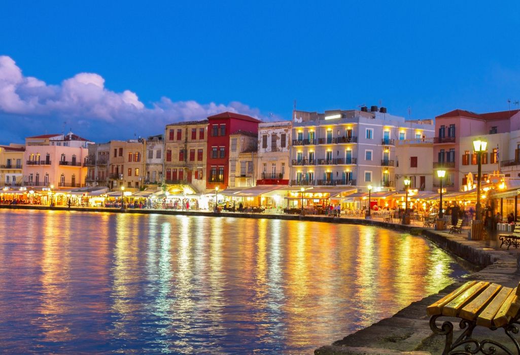 The old port of Chania at night with many lights in Crete Greece.