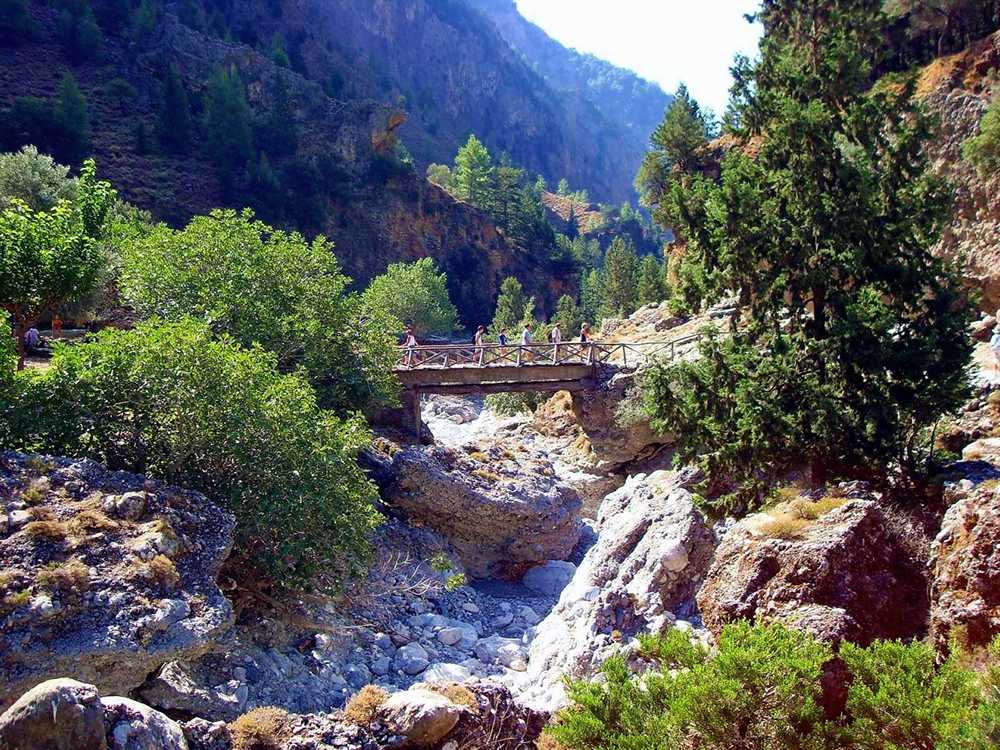 Samaria gorge bridge crossing five people in Chania Crete Greece.