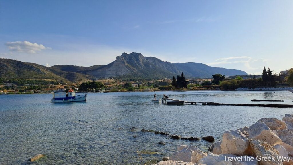 Ancient Port of Kechries in Corinth and a small fishing boat.