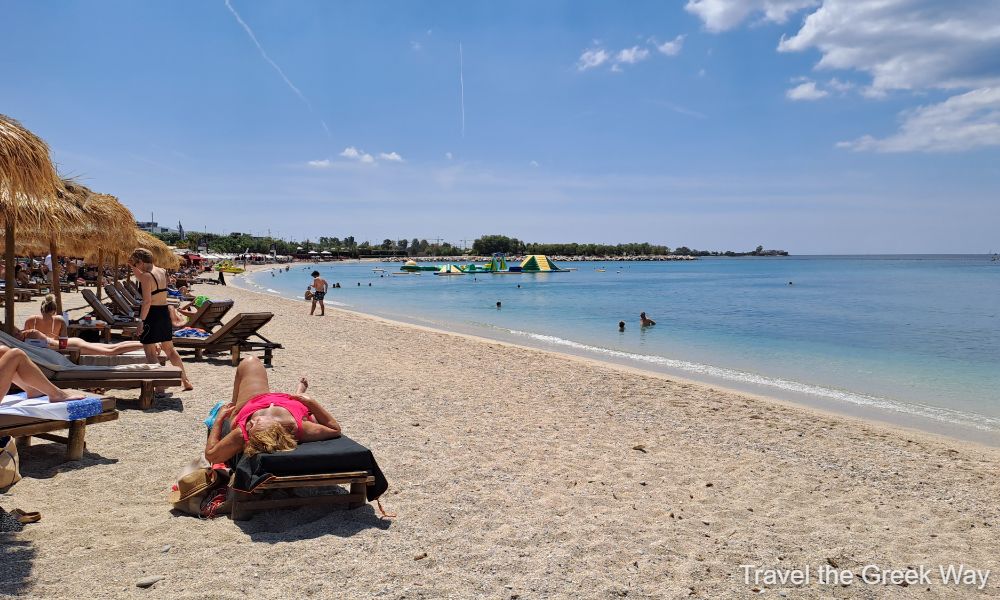 A sunny beach called Alimos with some people in a sunny day. Best Athens beach hotels.