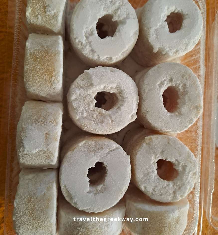 Traditional almond-based amygdalota cookies dusted with powdered sugar, a local delicacy in Kea, Cyclades, Greece.