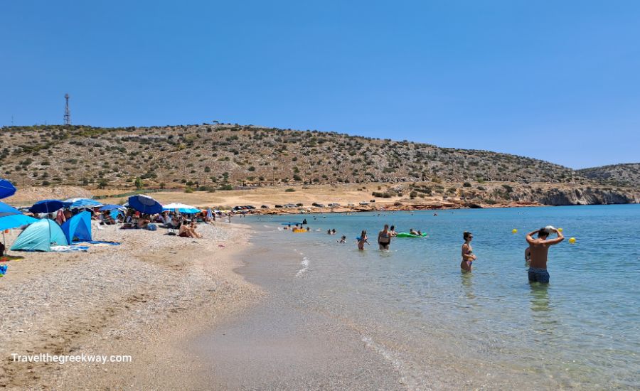 Varkiza Beach of Athens Riviera with swimmers and peaopl lying at the beach.