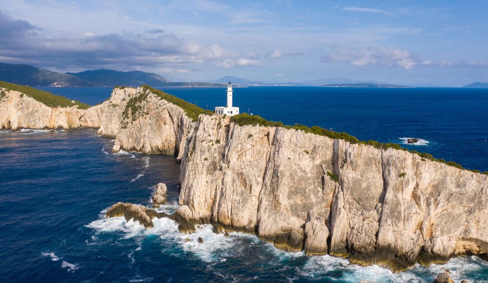 Things to do in Lefkada Greece: Cape Lefkatass on a cliff and the lighthhouse