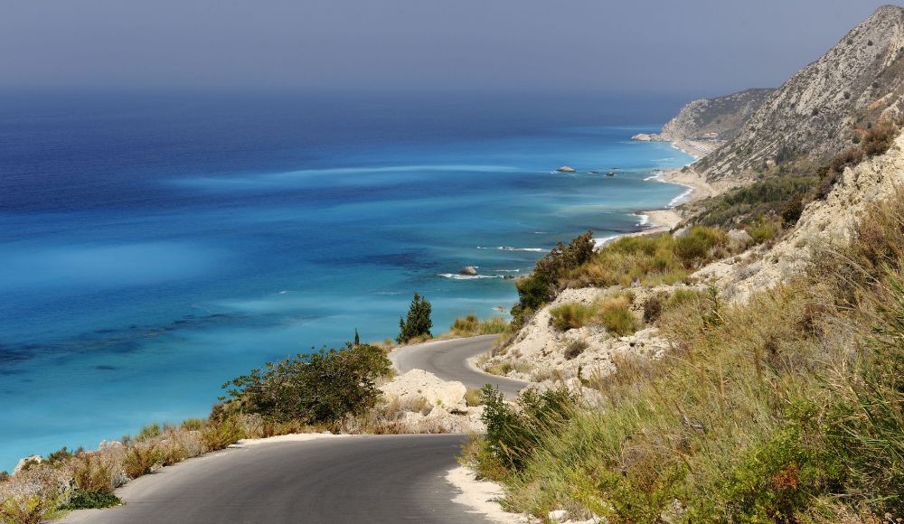 Winding roads by the sea in a Greek island. 