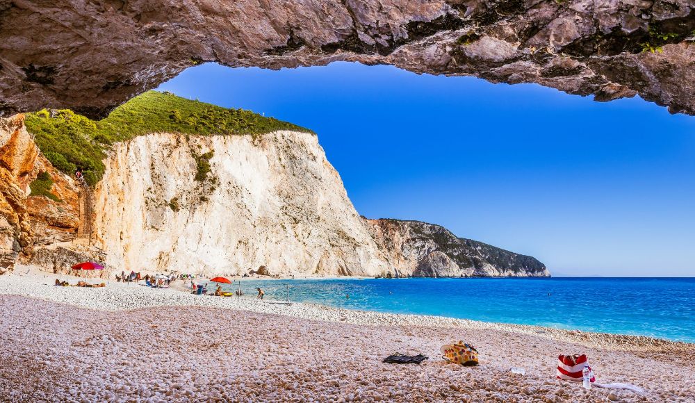 Things to do in Lefkada Greece: General view of Porto katsiki with people on the beach