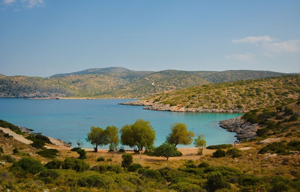 Agia Dynami Beach and the hills and trees around it. 