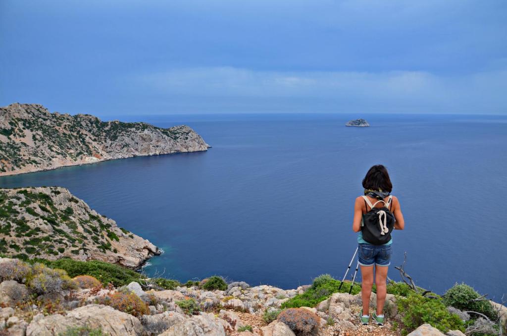 Ahiker in Chios looking at the sea. 