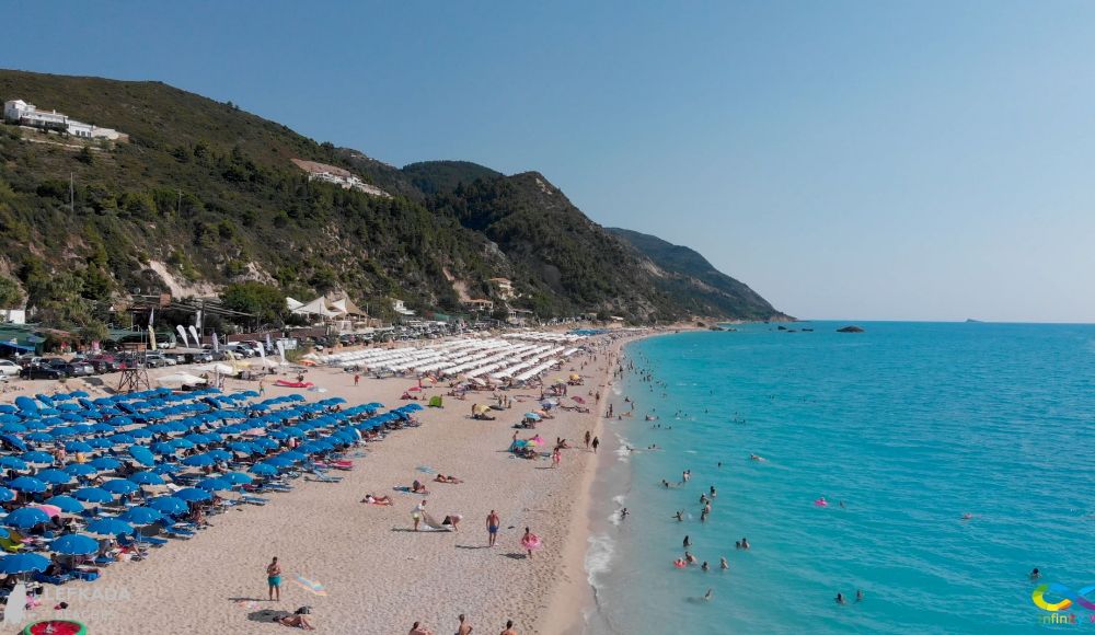 Things to do in Lefkada Greece: Long Kathisma beach with many sunbeds and umbrellas