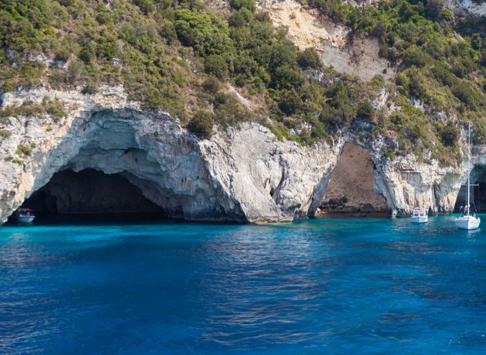 Best Things to do in Paxos Greece, Blue caves with yachts