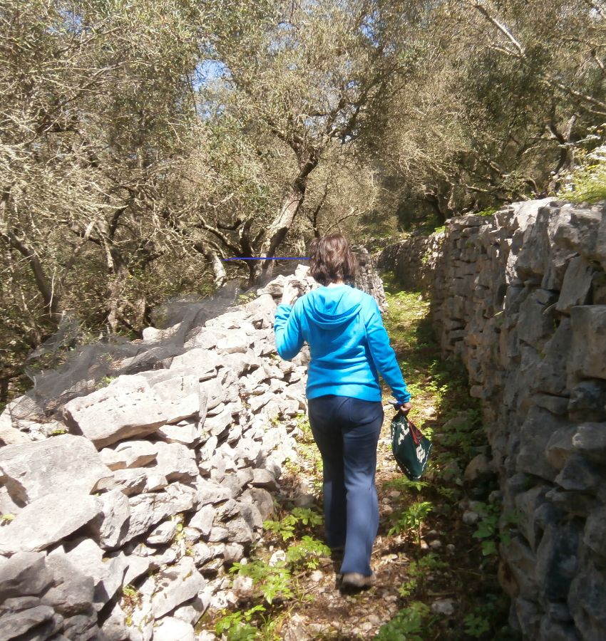 Best Things to do in Paxos Greece, Evgenia hiking in a trail