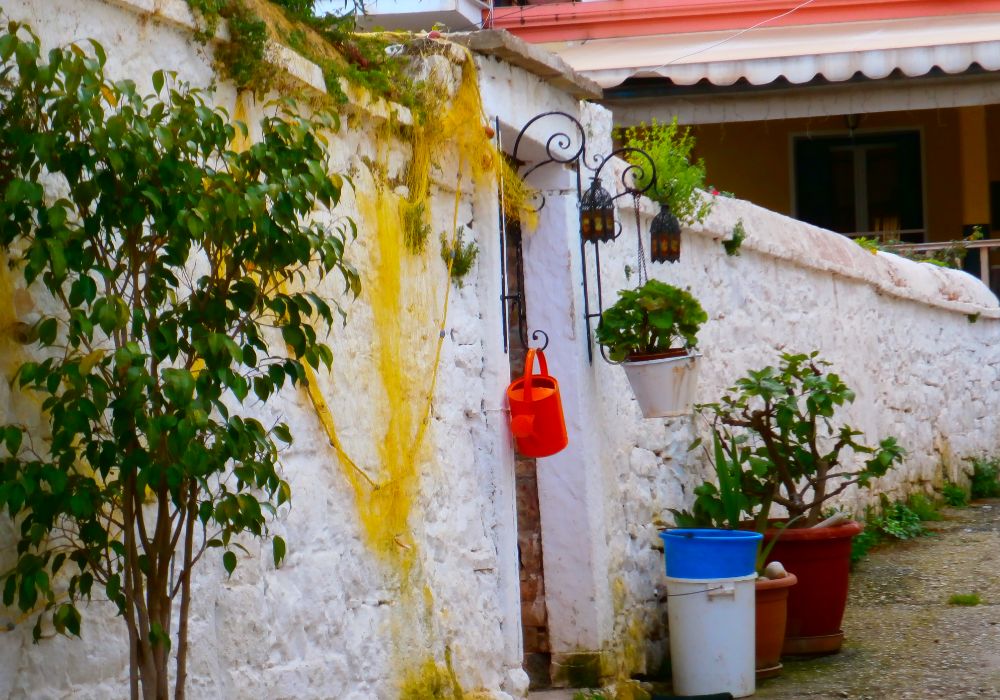 Best Things to do in Paxos Greece, fishing nets drying on a wall