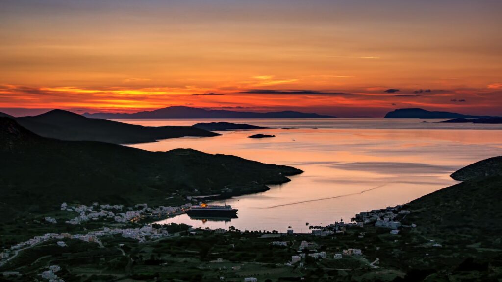 Katapola sunset with a ferry from Athens in Amorgos Island Greece.
