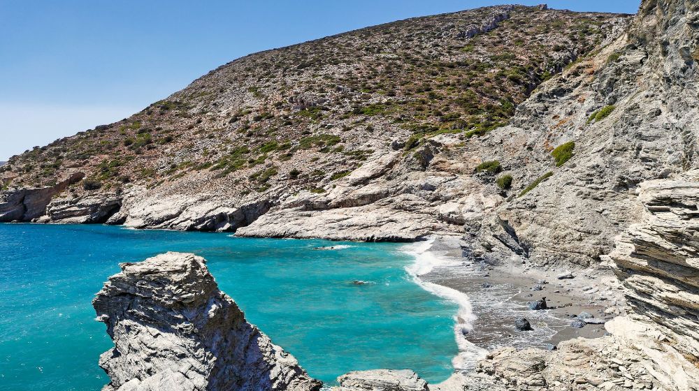 The rocky Mouros Beach in Amorgos Island Greece.