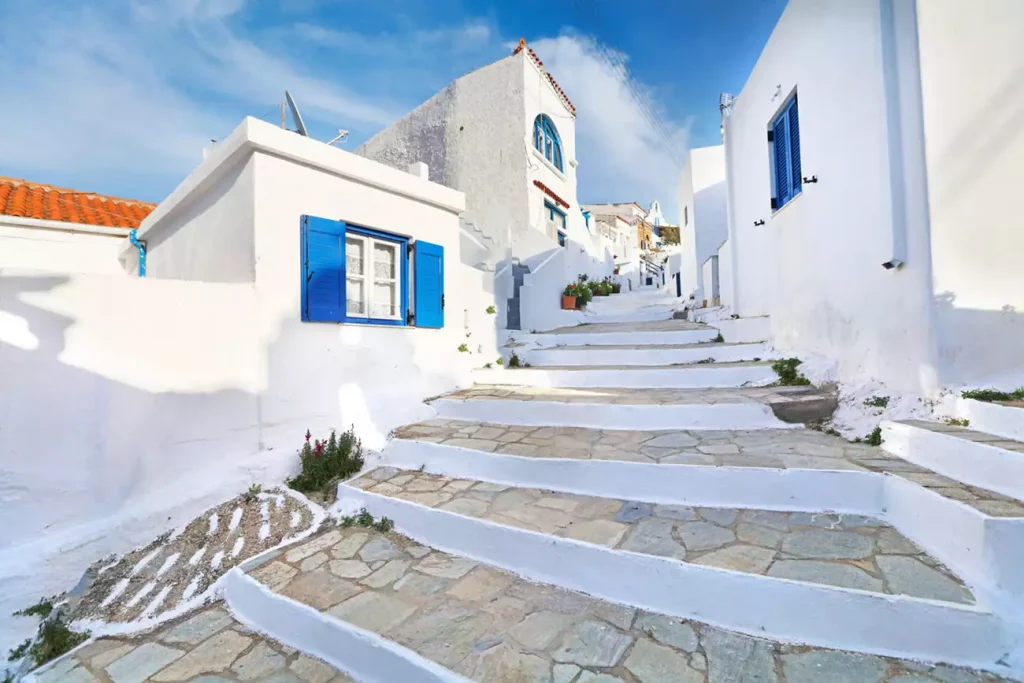 Whitewashed alley with houses in Kythnos Greece