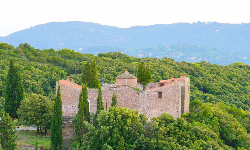 Monastery surrounded by deep forest in Greece.