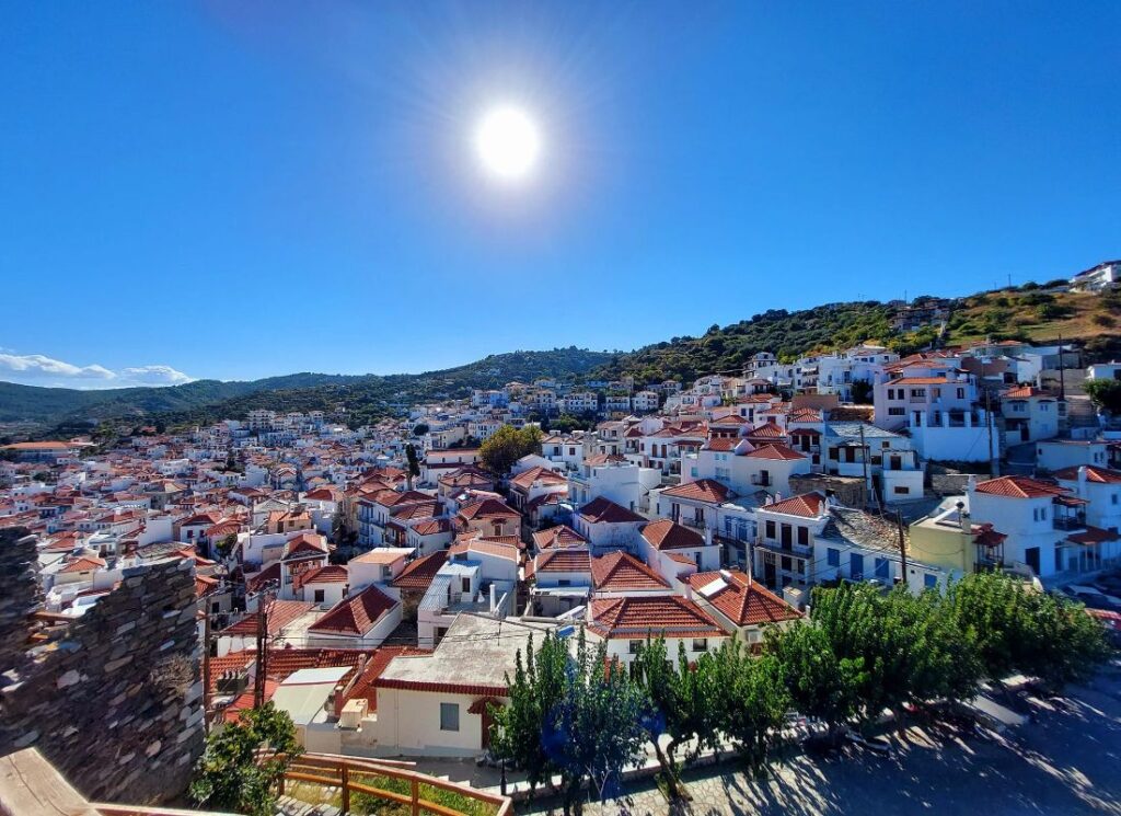 Skopelos Greece Chora with houses with tiled roofs and birght blue sky