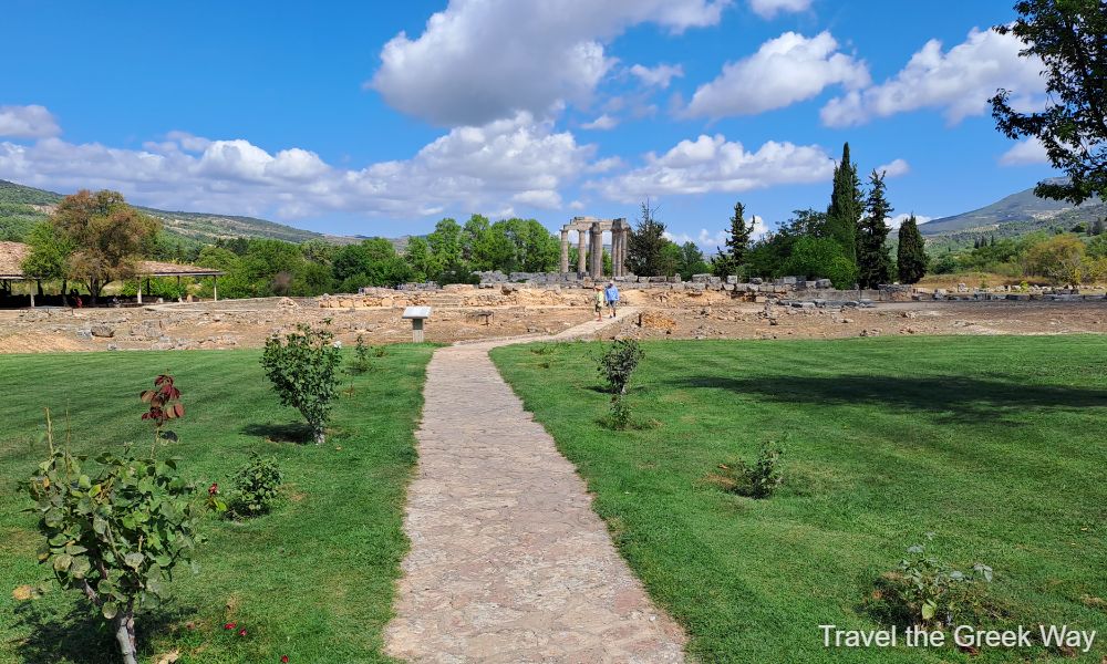 A general view of the Ancient Nemean with a couple walking on the paved road to the Temple of Zeus