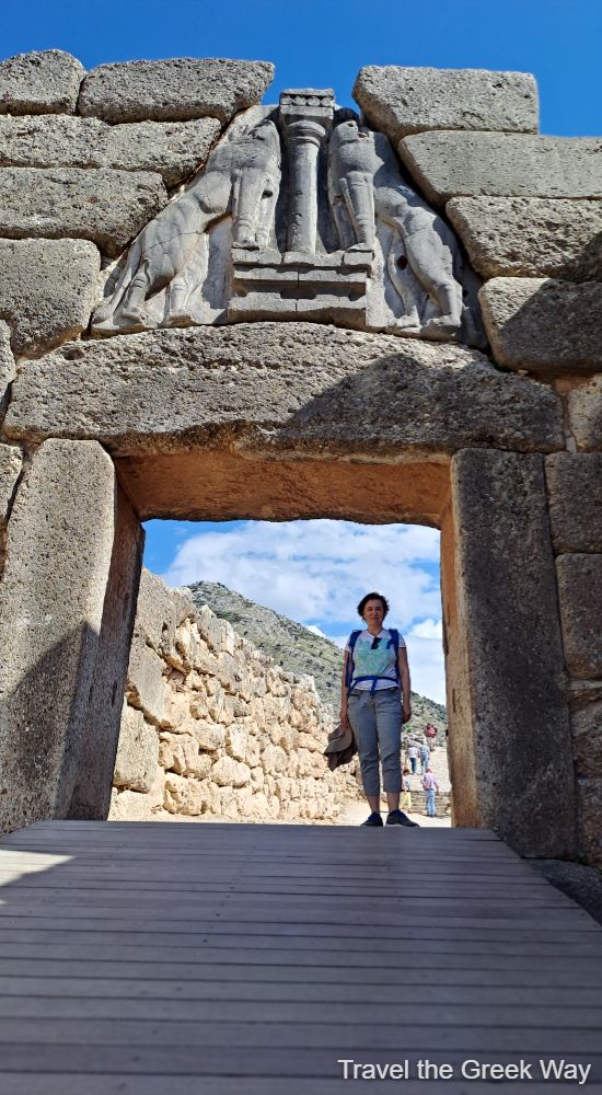Evgenia standing under Lion Gate of Mycenae in Greece in November.