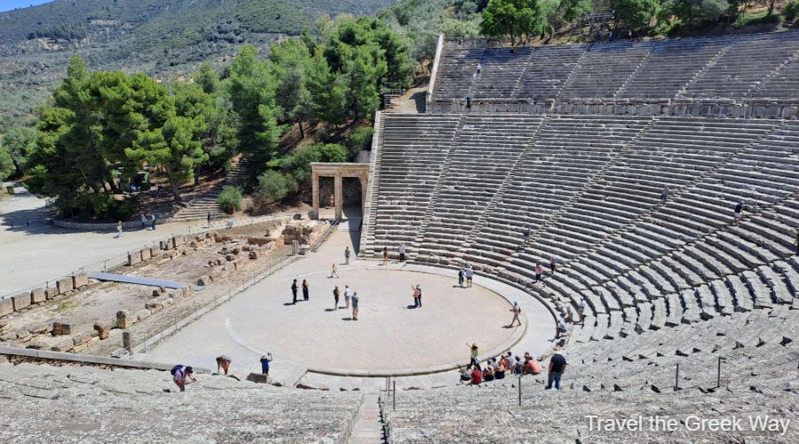 The Ancient Theater of Peloponnese with some people and trees in Theater of Epidaurus Peloponnese.