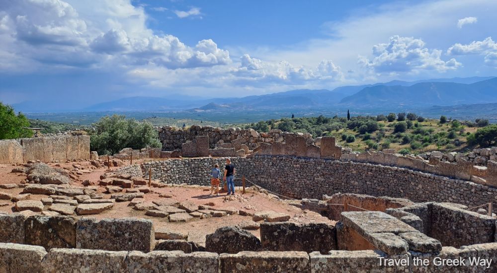 2 people inside the grave circle in Mycenae