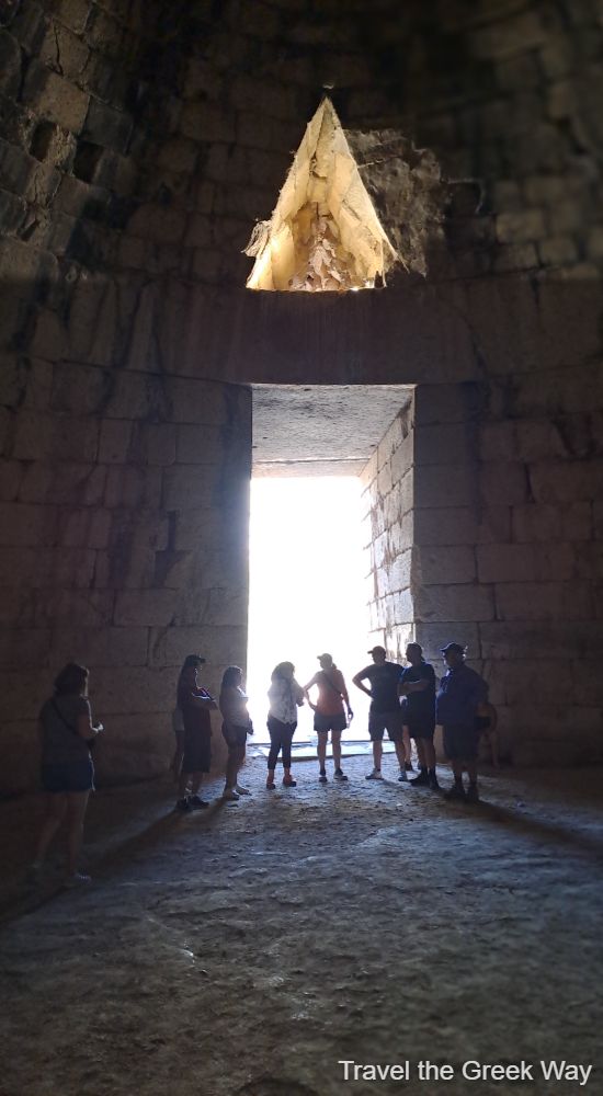 Inside the Treasury of Atreus in Mycenae with tourists