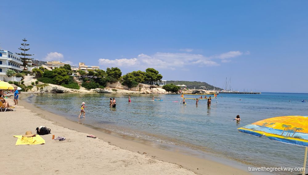 Agia Marina beach in Aegina with swimmers.