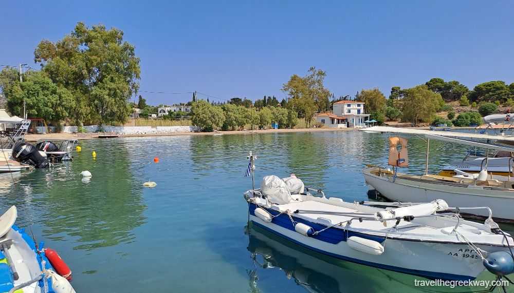 The sandy beach with fishing boats in Aegina. 