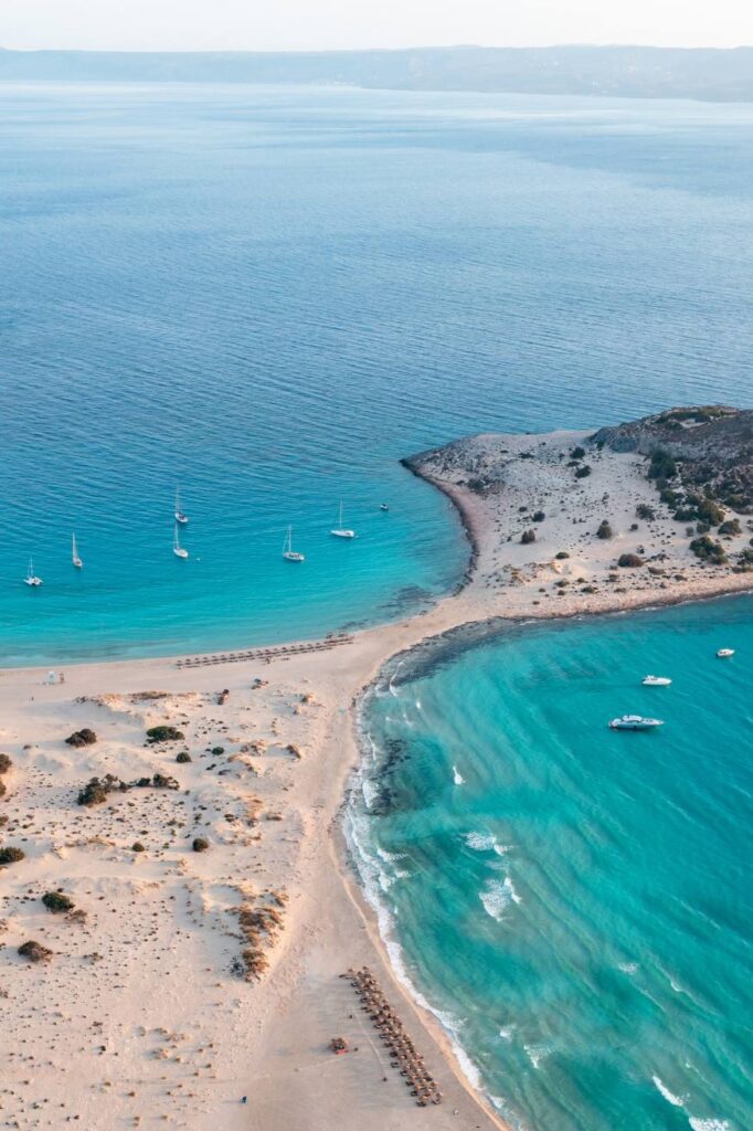 Looking down at the stunning turquoise waters and white sand dunes of Simos Beach on Elafonisos island, Laconia.