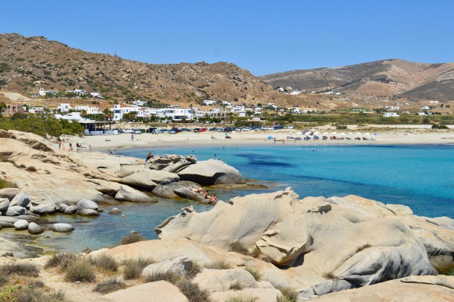 Clear blue waters and rocky coastline at Mikri Vigla Beach in Naxos.