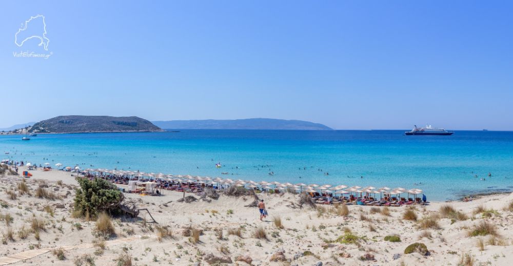 The sandy beach of Simos with beds and umbrellas in Elafonisos