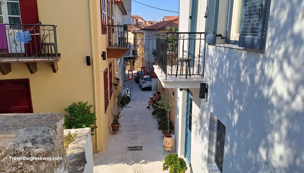 A tiny alley with neoclassic buildings in a Greek town. 