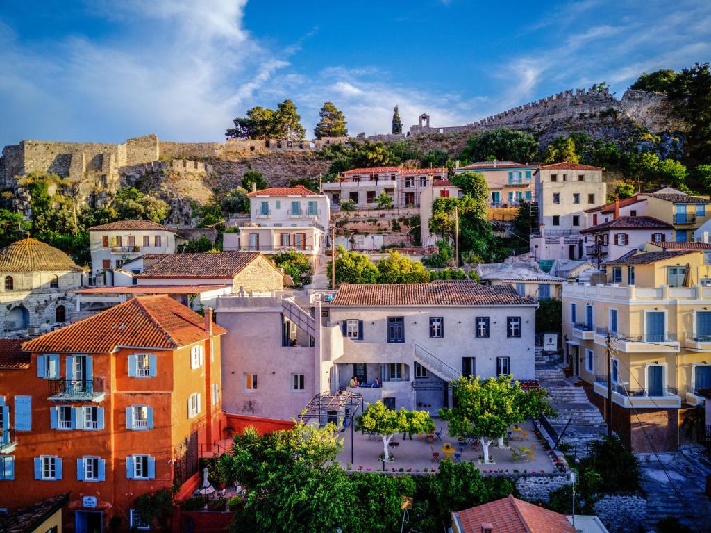Colorful neoclassic houses built on the hill of Palamidi Castle in Nafplio Greece. 
