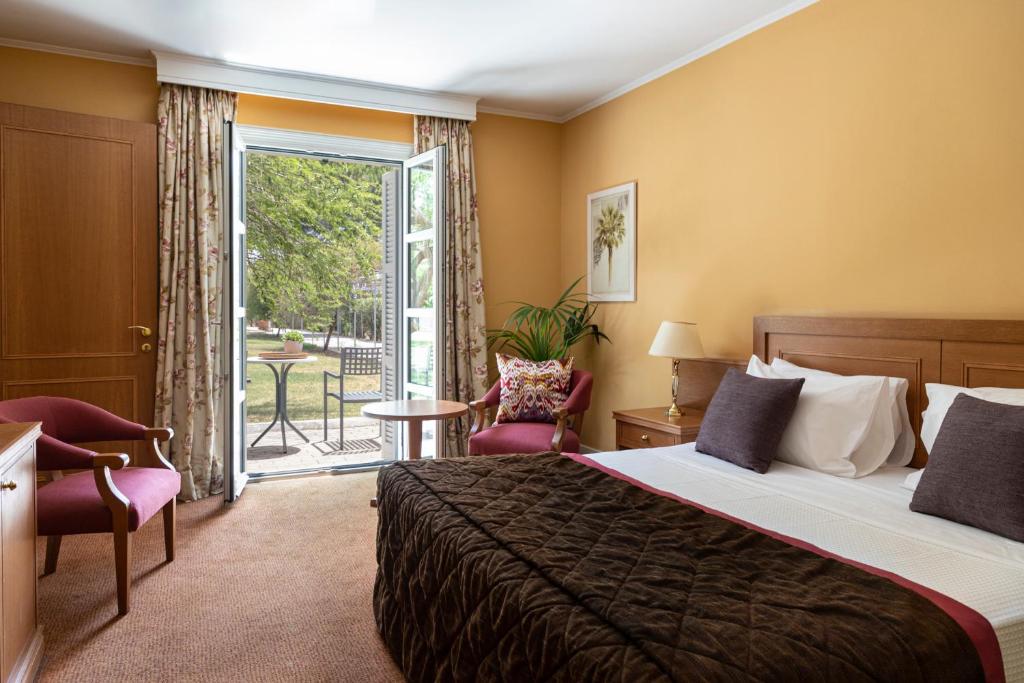 The Amalia Hotel Nafplio room with a garden view balcony. 