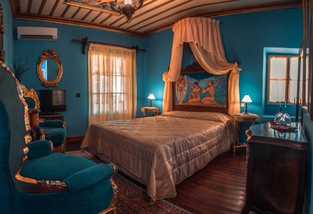 A  blue decorated hotel room with gilded furniture in Greece. 