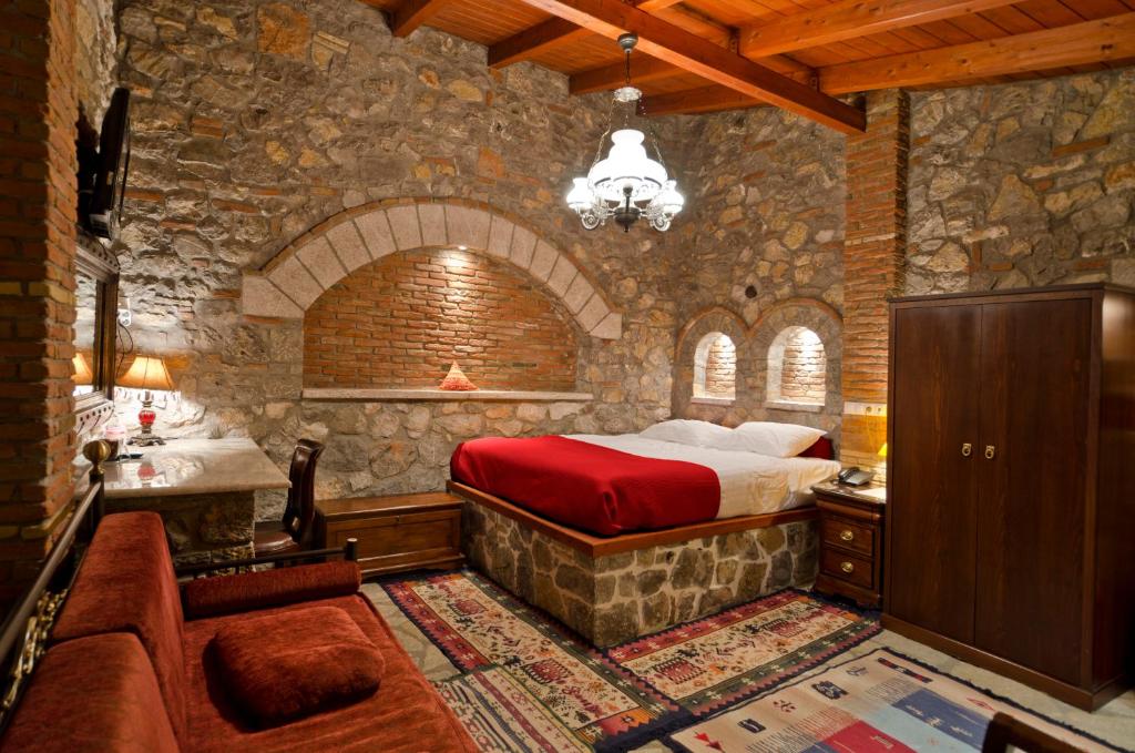 An imprssive stone wall of Marinanna hotel room in Nafplio Greece. 