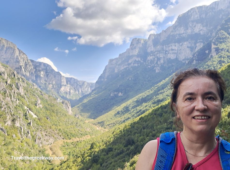 Evgenia smiling in front of Vikos Gorge in Monodendri Greece.