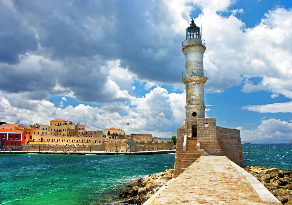 Crete in winter Chania Venetian Port with clouds and Lighthouse.