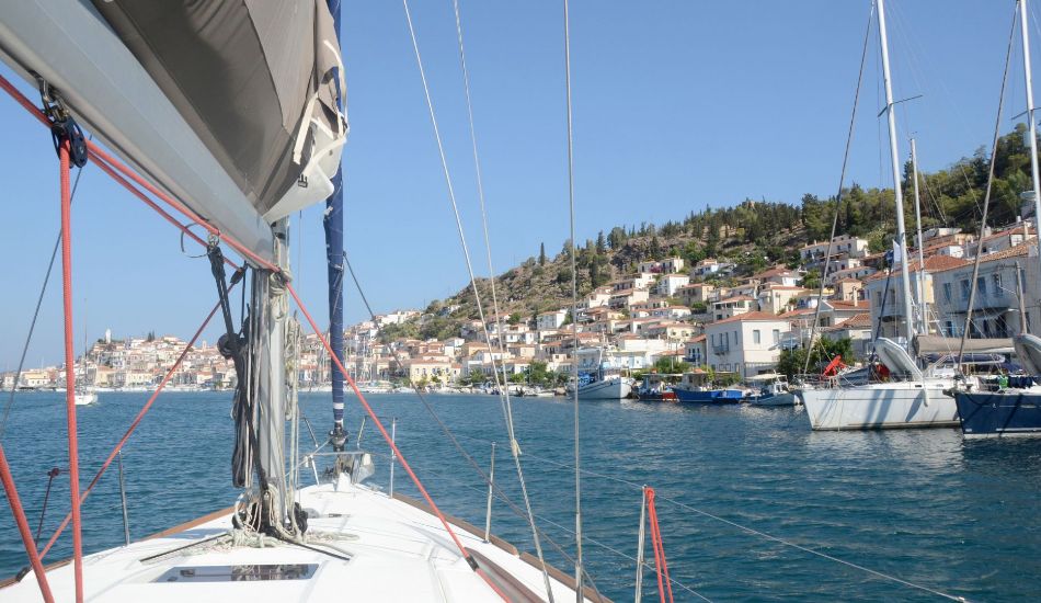 Sailing in Greece:  a yacht sailing along Poros island. 