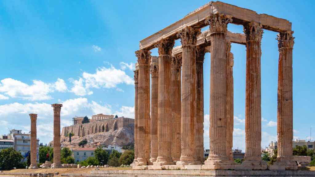 The Temple of Olympian Zeus and Acropolis Hill in Athens Greece. 
