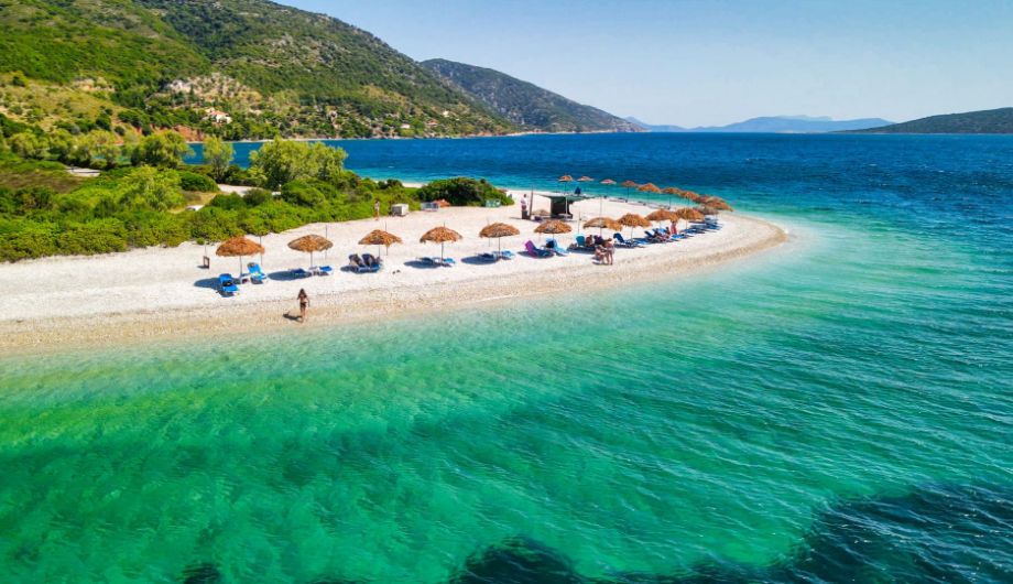 An aerial view captures the breathtaking beauty of Agios Dimitrios beach on Alonissos Island.