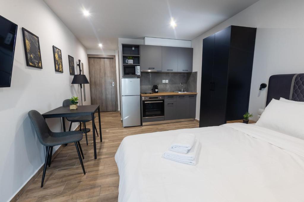 Raise Athens Metro Apartments room with small kitchennet. 