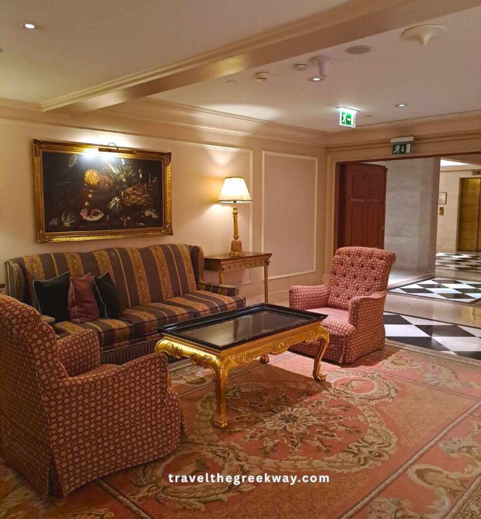 Cosy living room with wall paintings in the Grande Bretagne Athens.