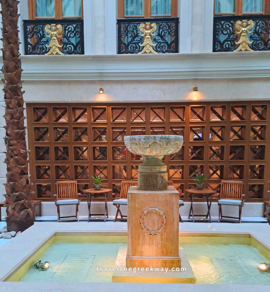 The impressive marble fountain and spa in the Hotel Grande Bretagne.