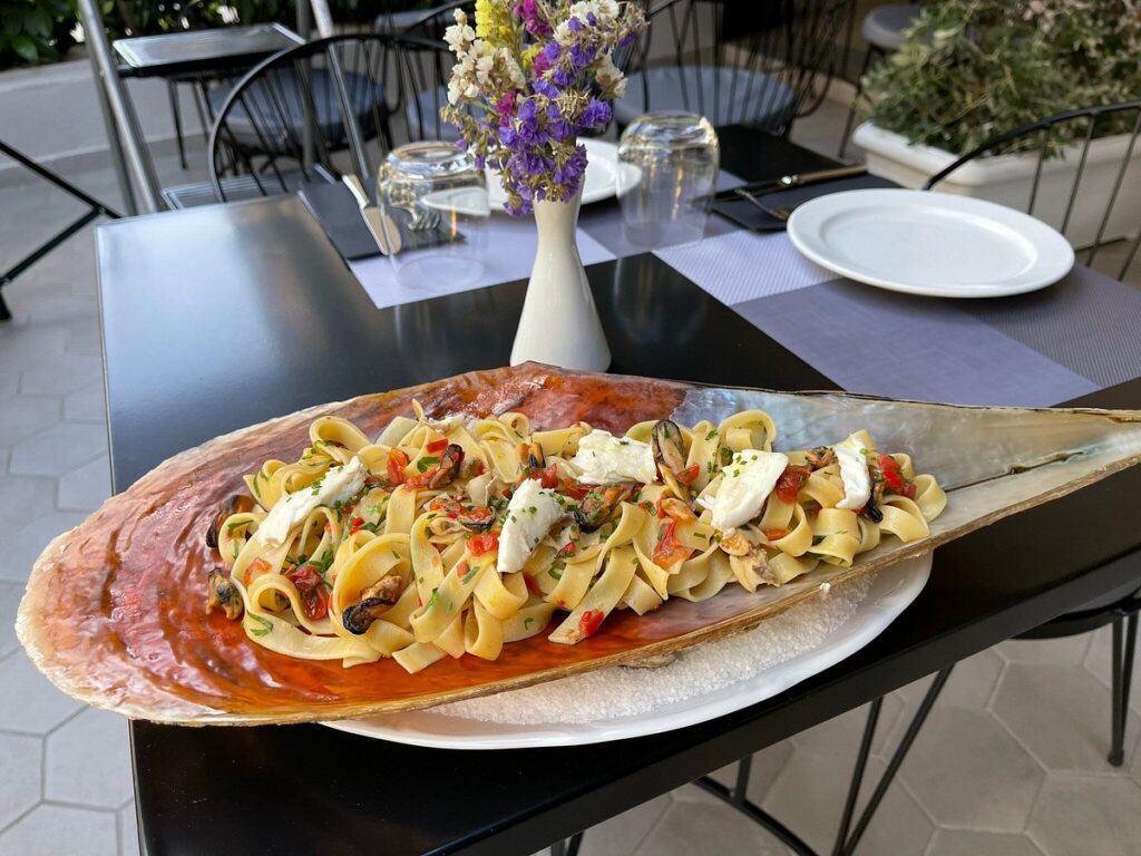 Pasta dish served in a large seashell at Da Bruno restaurant in Paleo Faliro.