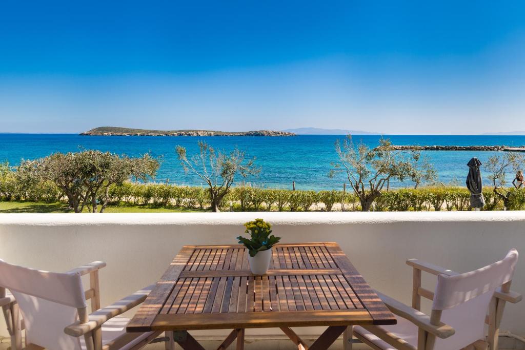 Stunning sea view from a wooden table on the balcony of La Mer Hotel in Paros