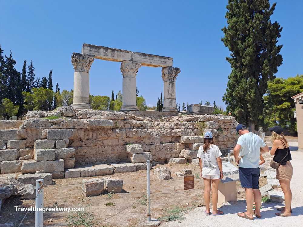 Visitors exploring the remnants of the Temple of Octavia in Ancient Corinth