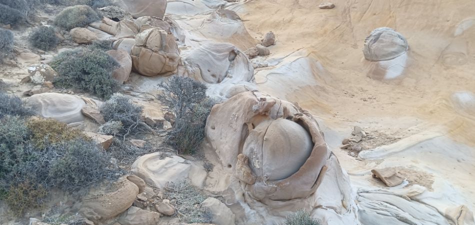 Close-up of the unique rock formations at Faraklo Geological Park in Lemnos, showcasing smooth, rounded boulders.